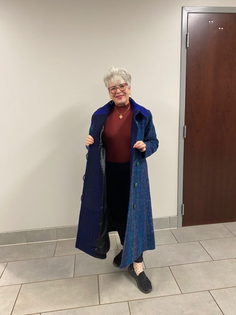 Dale modeling one of Liz's coats