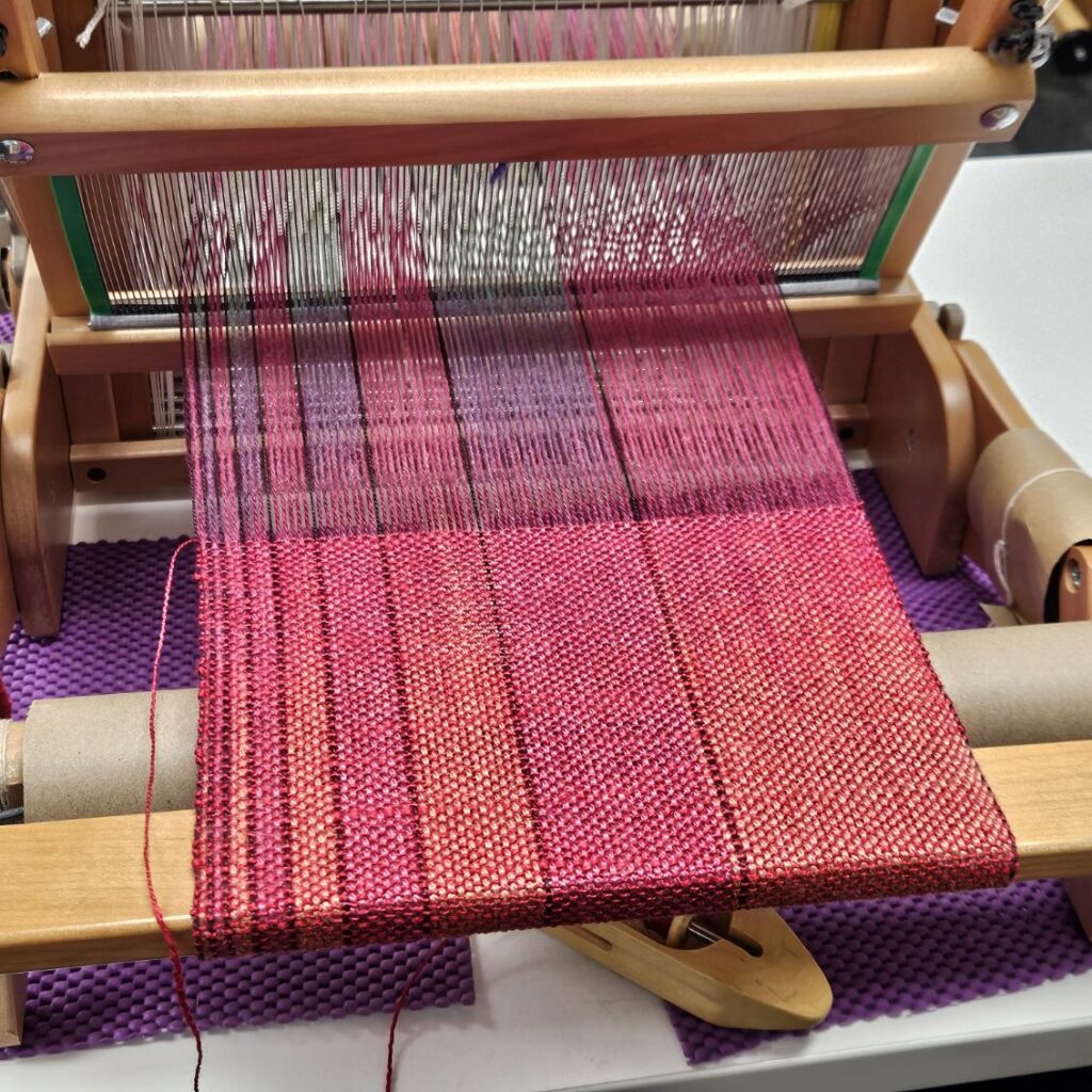Silk warp on a table loom