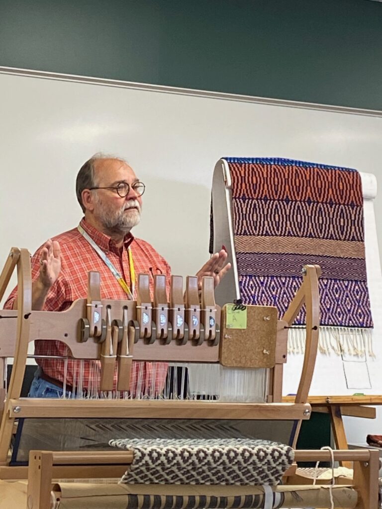 Tom talks at the front of the class